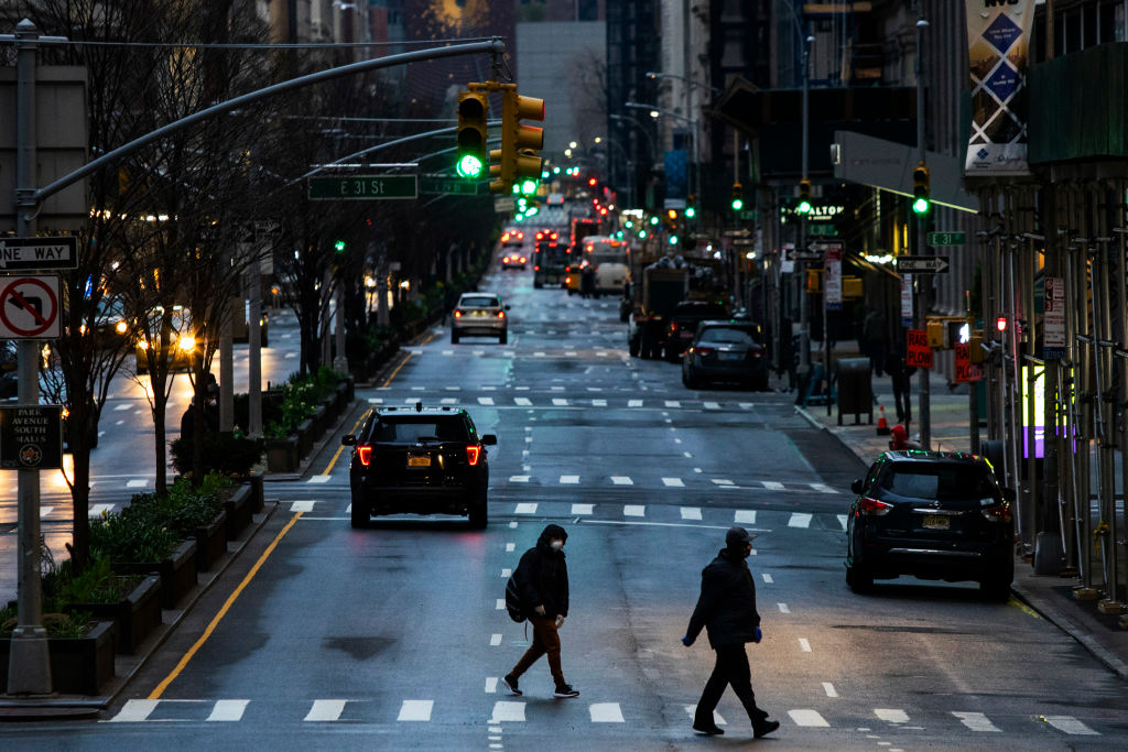 People cross Park Av. after it was announced that some streets will be shut as lockdown continues in response to the coronavirus (COVID-19) outbreak.