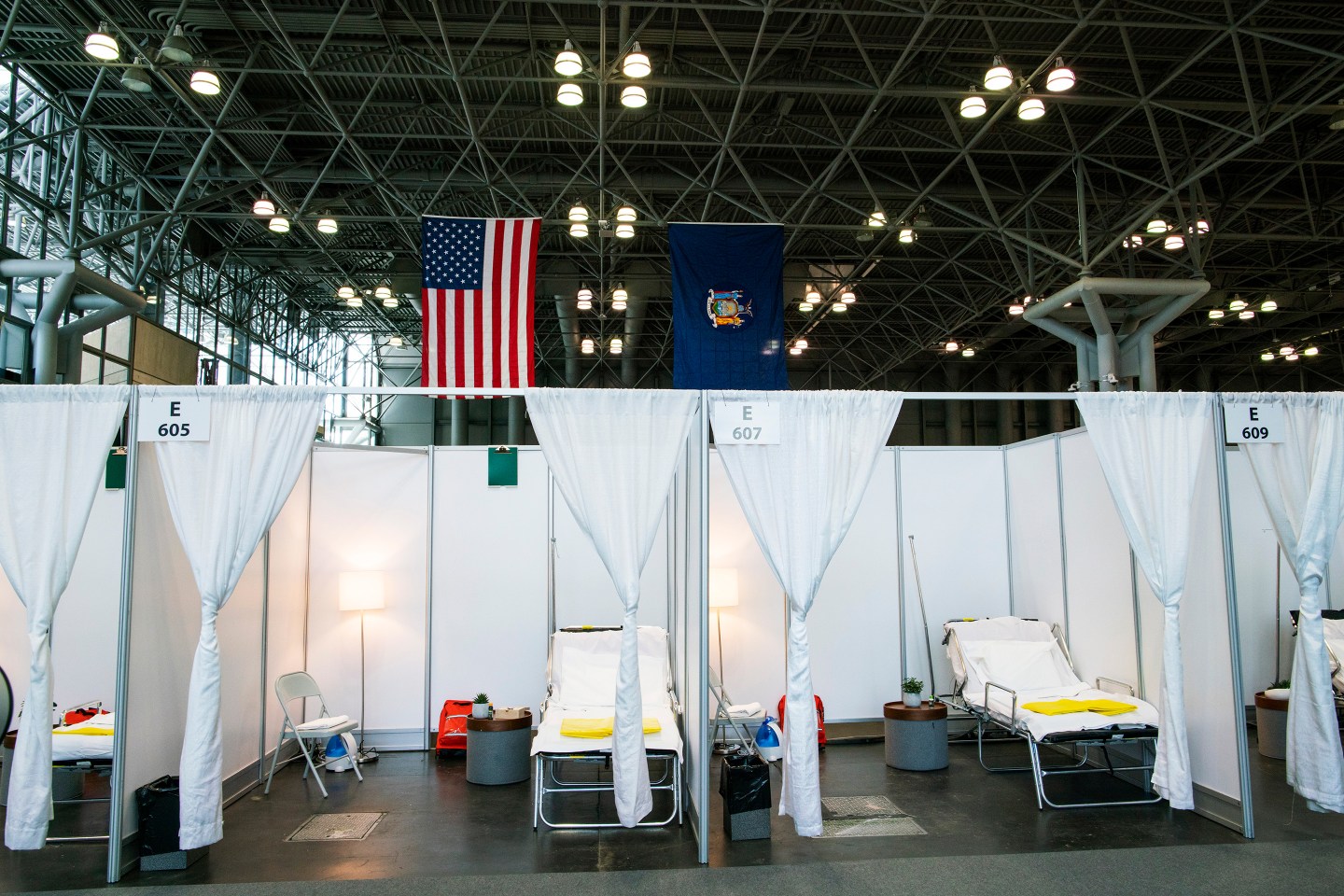 Hospital bed booths are set up at the Jacob K. Javits Convention Center which is being turned into a hospital to help fight coronavirus cases on March 27, 2020 in New York City.