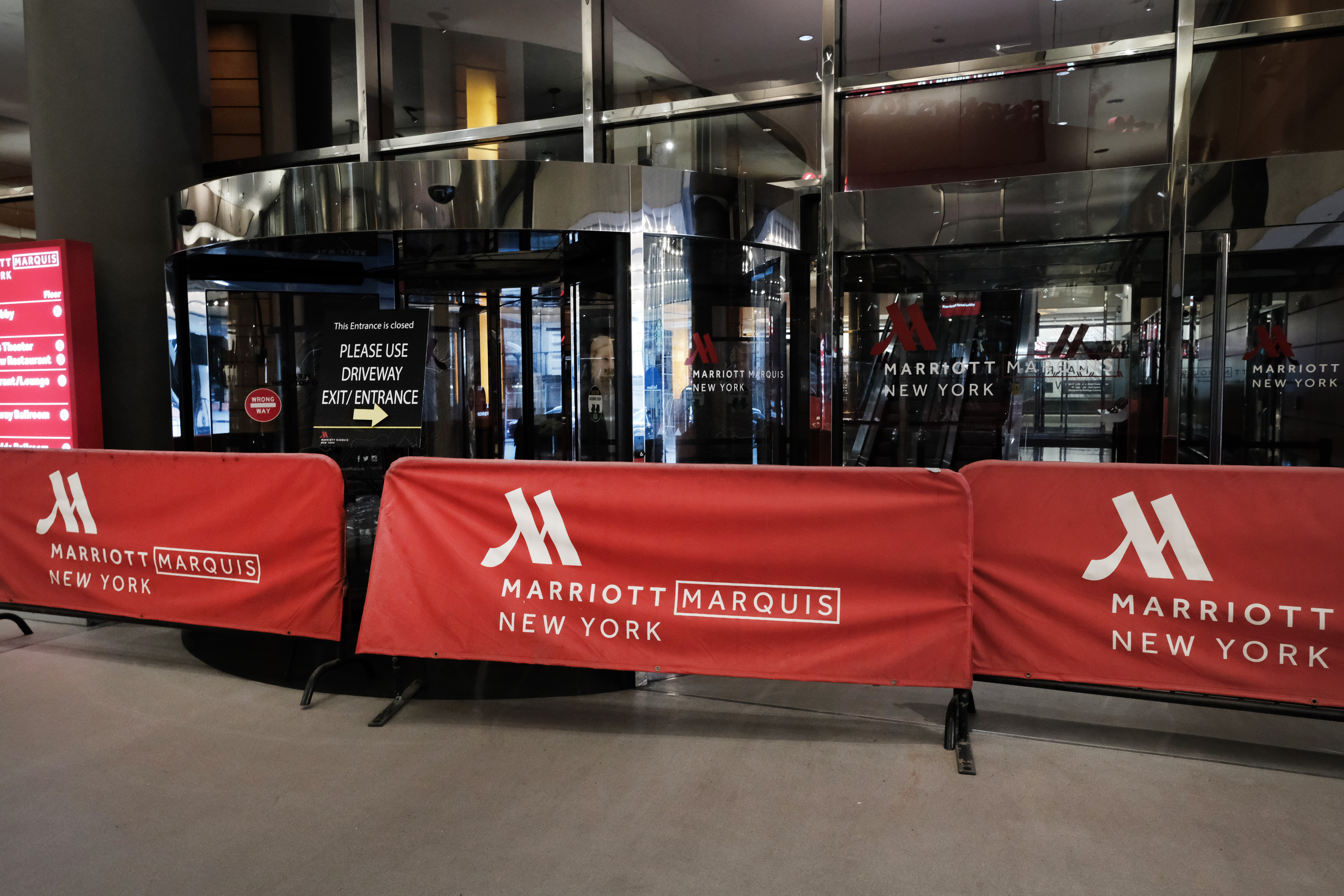 NEW YORK, NY - MARCH 22: The Marriott hotel in Times Square is barricaded as much of the city is void of cars and pedestrians over fears of spreading the coronavirus on March 22, 2020 in New York City. Marriott has announced furlough thousands of workers at its properties throughout the country. Across the country schools, businesses and places of work have either been shut down or are restricting hours of operation as health officials try to slow the spread of COVID-19. (Photo by Spencer Platt/Getty Images)