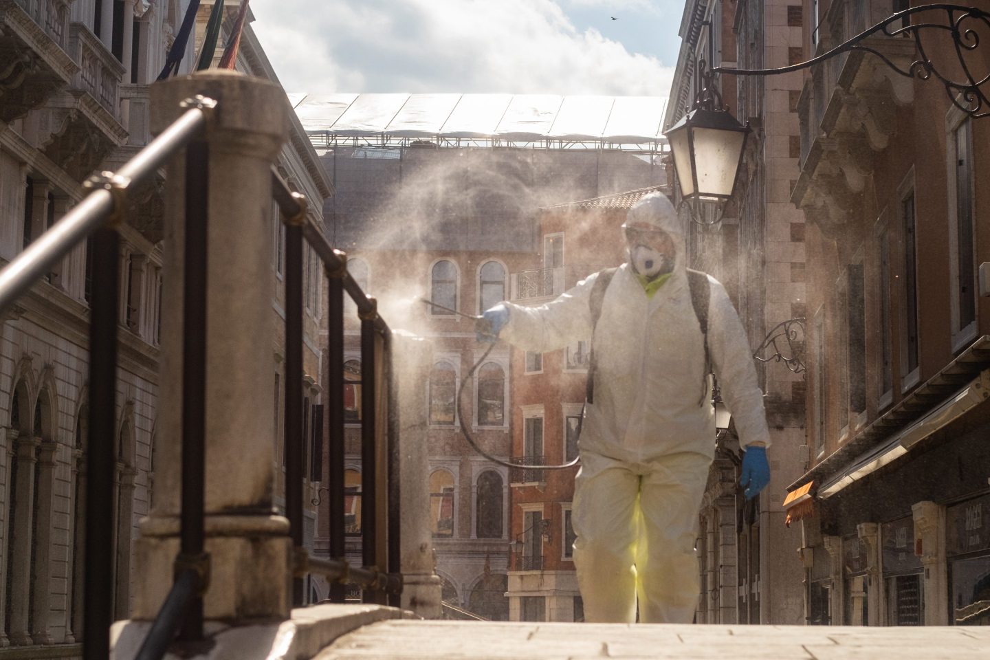 VENICE, ITALY - MARCH 25: An ecological operator sanitizes a bridge on March 25, 2020 in Venice, Italy. The Italian government continues to enforce the nationwide lockdown measures to control the spread of COVID-19.