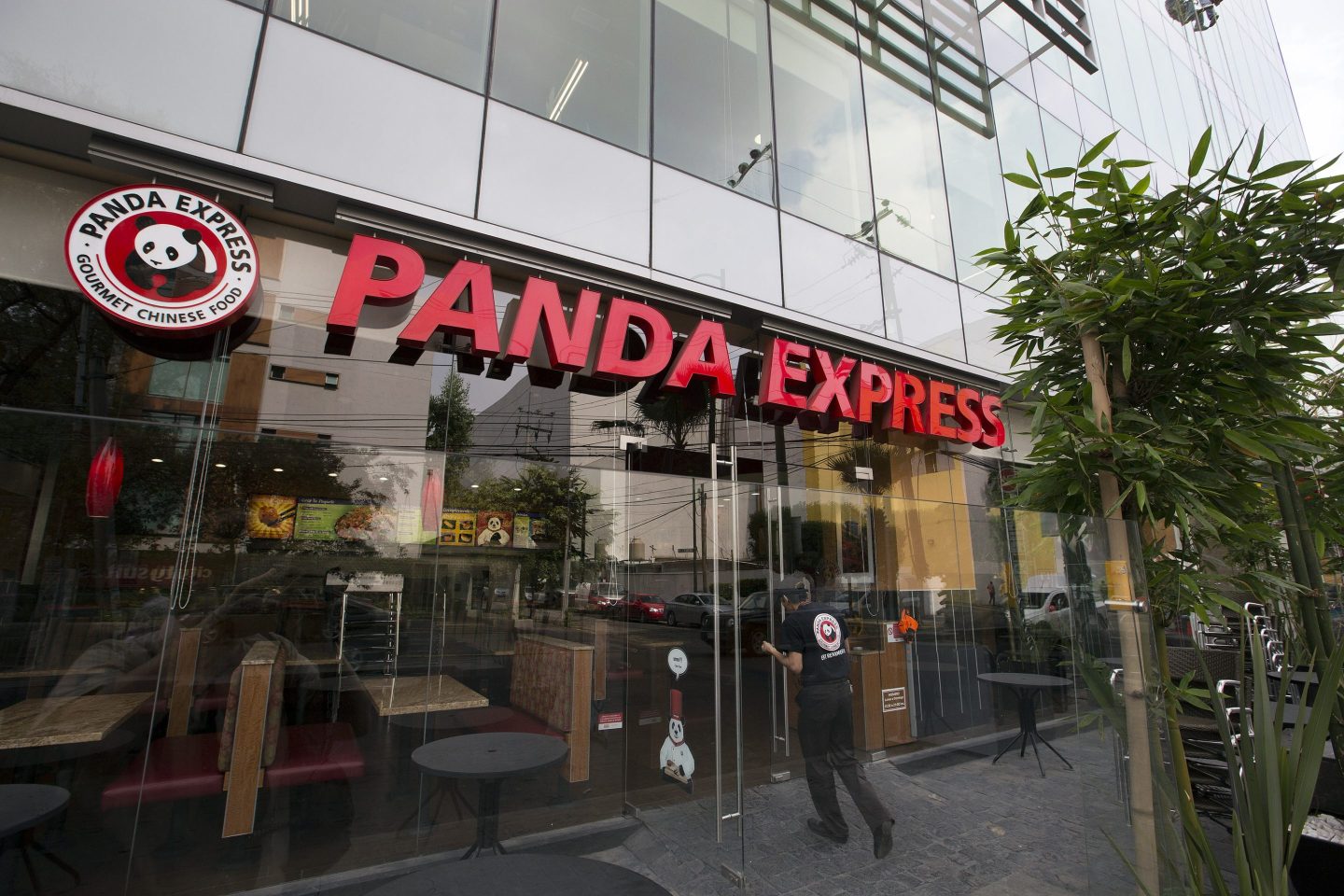 An employee enters a Panda Express restaurant in Mexico City, Mexico, on Wednesday, June 26, 2013. Grupo Gigante SAB, the owner of Panda Express restaurants in Mexico, is scheduled to hold a shareholders meeting on June 27 to discuss the company's acquisition of Office Depot de Mexico.