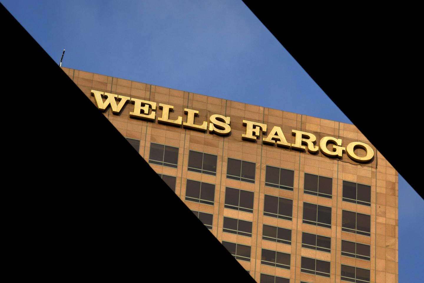 Wells Fargo &amp; Co signage is displayed on the Wells Fargo Center skyscraper in downtown Los Angeles, California, U.S., on Tuesday, July 7, 2015.