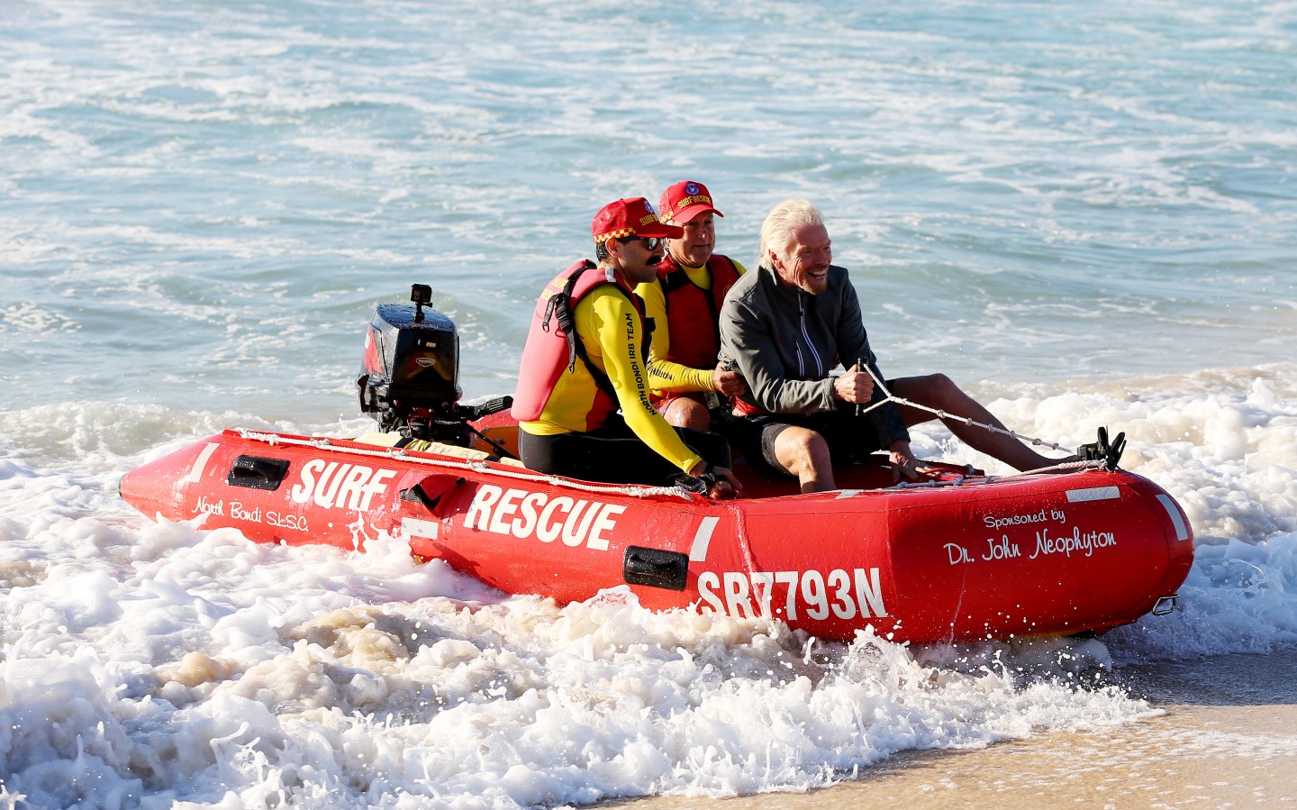 Richard Branson arrives at Bondi Beach via a rubber dinghy on Nov. 13, 2019 in Sydney, Australia.