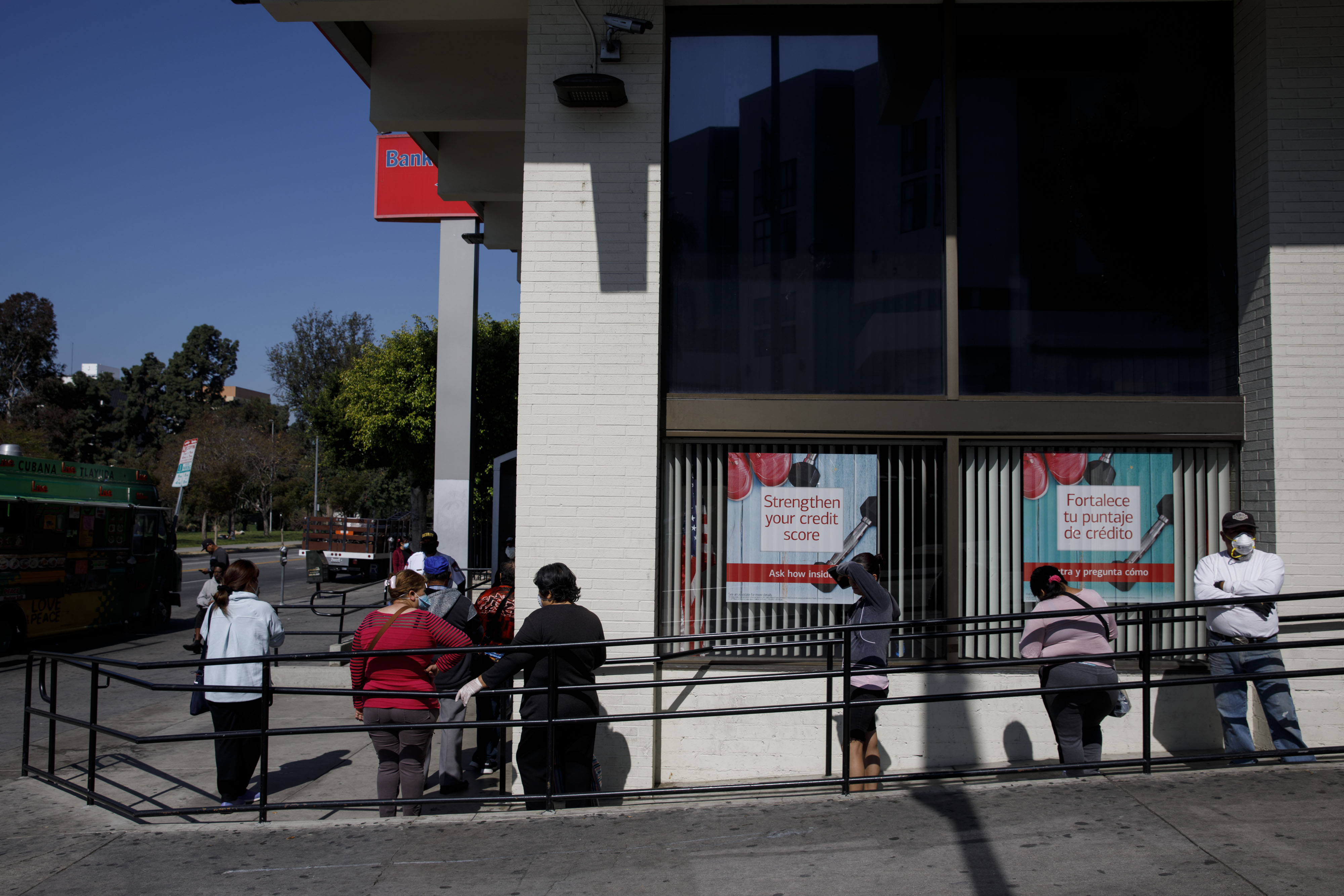 Customers wait in line outside a Bank of America branch in California. 