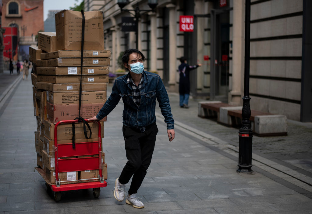 Chinese struggle to return to work as coronavirus controls ease