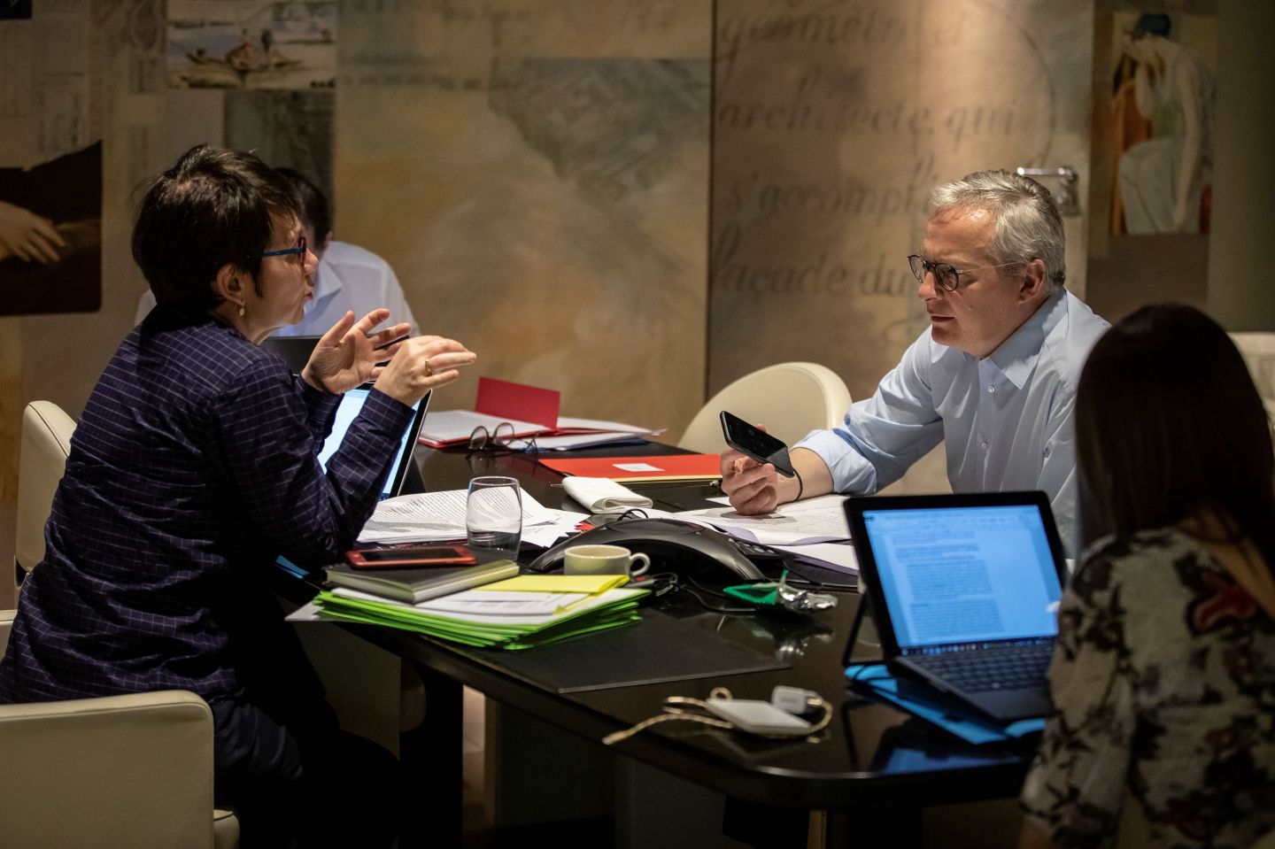 French Economy and Finance Minister Bruno Le Maire speaks in his office with French Treasury director Odile Renaud-Basso (L) during a break of a Eurogroup videoconference meeting of the eurozone finance ministers to discuss coronavirus response on April 7, 2020 at the French Economy ministry in Paris. - EU finance ministers hope to agree a coronavirus economic rescue package for the worst-hit member states on Tuesday, but will fall short of demands from beleaguered Spain and Italy. (Photo by Thomas SAMSON / AFP) (Photo by THOMAS SAMSON/AFP via Getty Images)