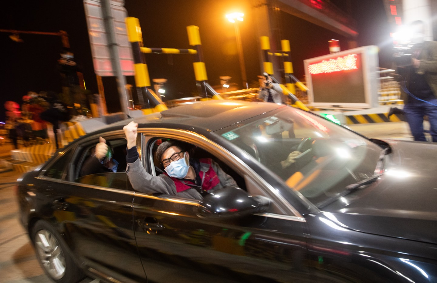 WUHAN, CHINA - APRIL 8, 2020 - Passengers wave before leaving Wuhan, Hubei Province, China, in the early hours of April 8, 2020.