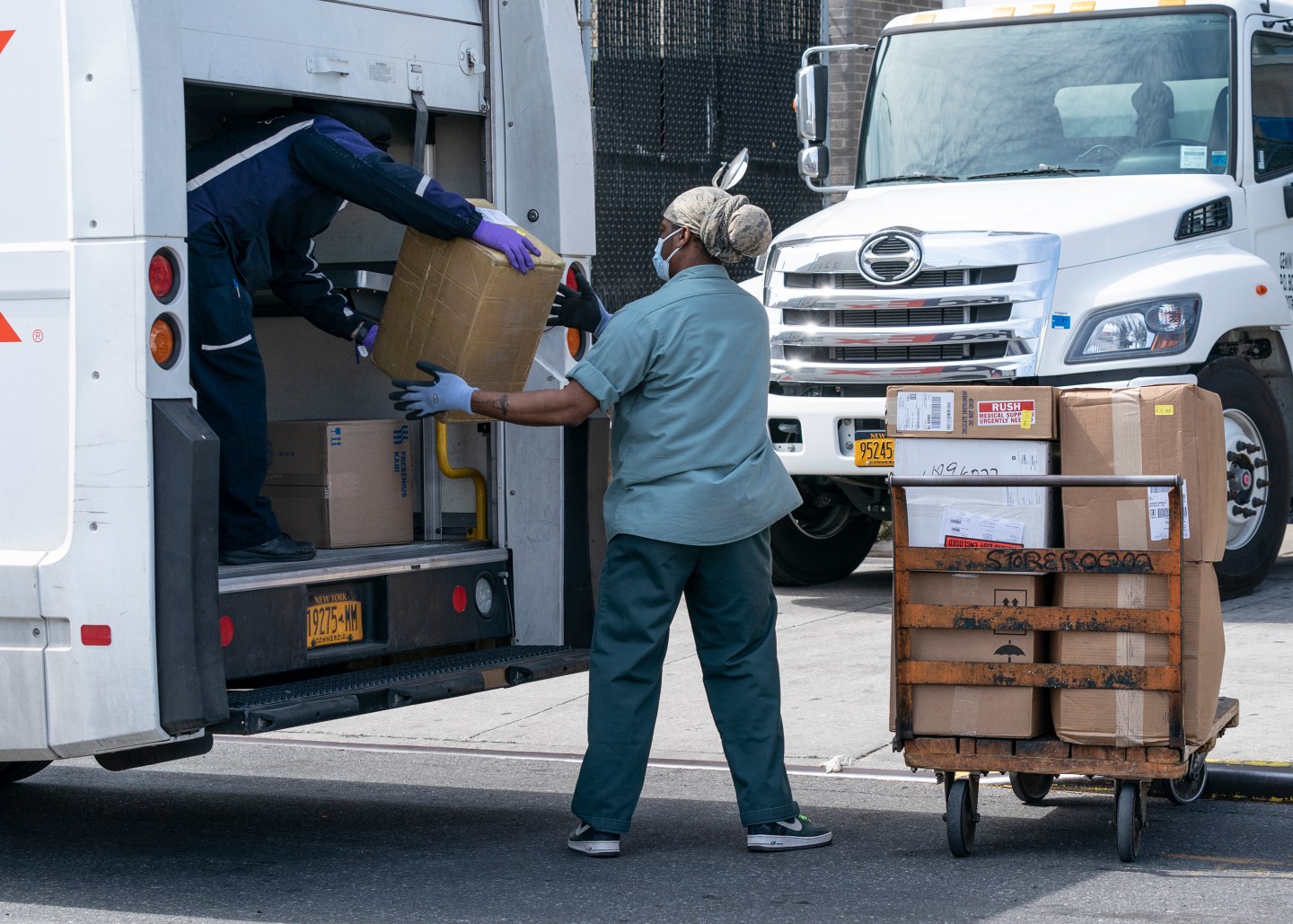 FedEx worker is making delivery amid COVID-19 pandemic in