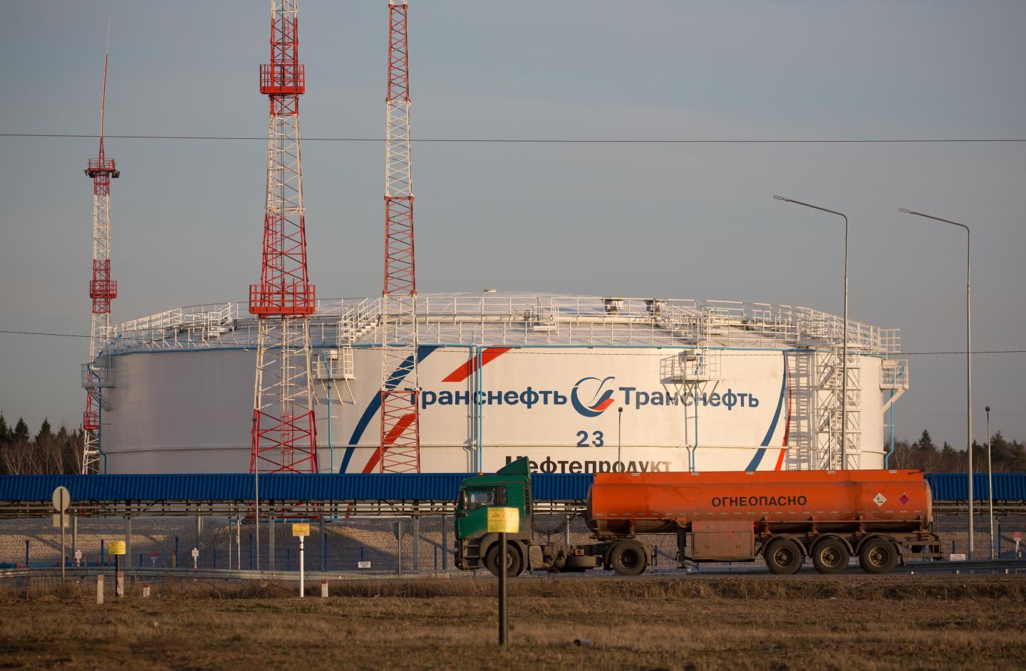 A gas tanker drives past an oil storage tank at the Volodarskaya line operation dispatcher station (LODS), operated by Transneft PJSC, in Konstantinovo village, near Moscow, Russia, on Tuesday, April 7, 2020. The worlds largest oil producers moved closer to an unprecedented deal to ratchet back production and rescue crude markets from a pandemic-driven collapse, after Russia signaled its ready to make cuts. Photographer: Andrey Rudakov/Bloomberg via Getty Images