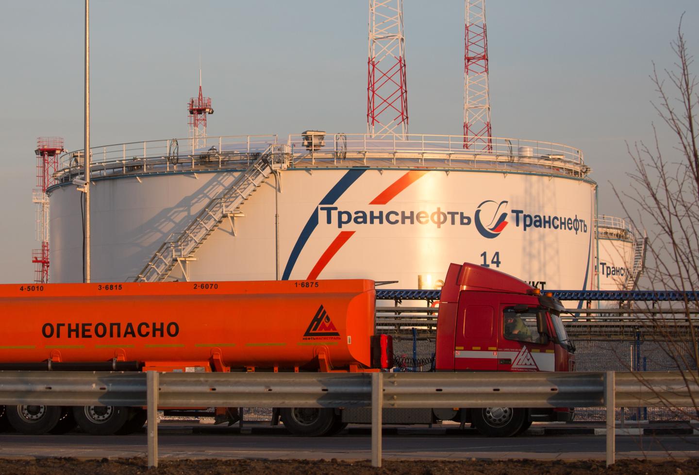 A gas tanker drives past oil storage tanks at the Volodarskaya line operation dispatcher station (LODS), operated by Transneft PJSC, in Konstantinovo village, near Moscow, Russia, on Tuesday, April 7, 2020. The worlds largest oil producers moved closer to an unprecedented deal to ratchet back production and rescue crude markets from a pandemic-driven collapse, after Russia signaled its ready to make cuts. Photographer: Andrey Rudakov/Bloomberg via Getty Images