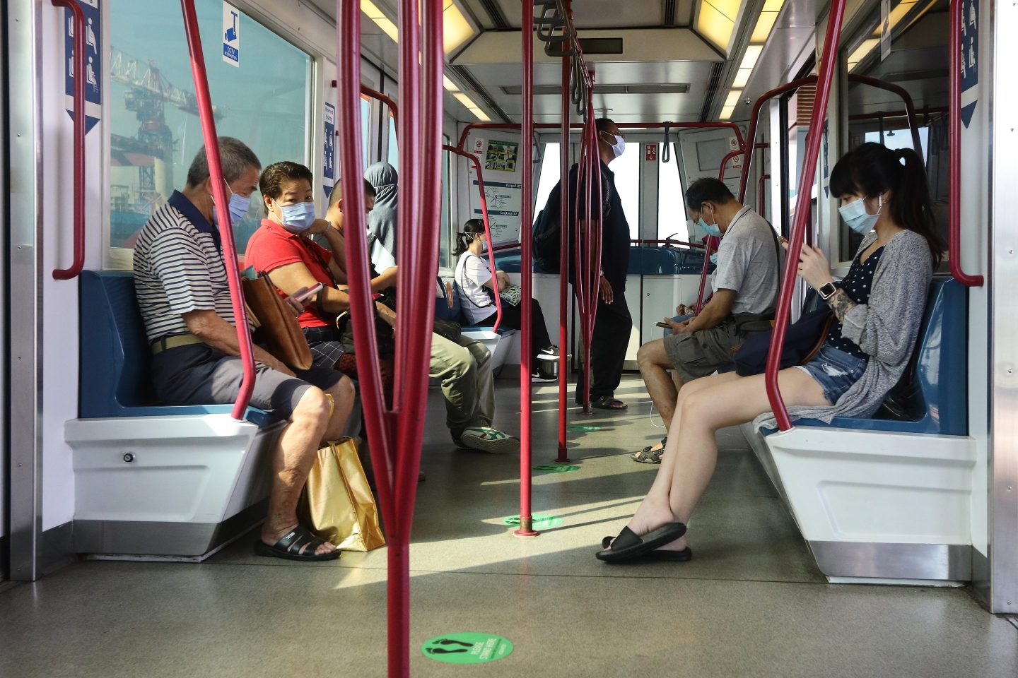 masked subway riders in singapore