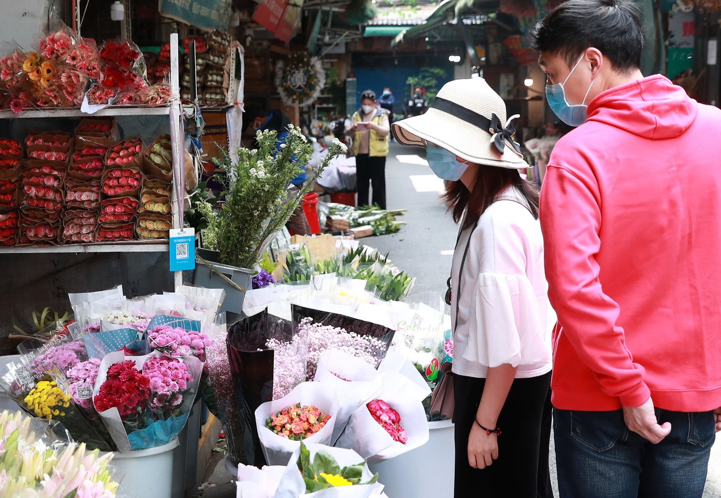 WUHAN, April 19, 2020 -- Residents select flowers at a flower market in Wuhan, central China's Hubei Province, April 19, 2020. As the novel coronavirus epidemic wanes, flower markets in Wuhan have resumed business.(Photo by Zhao Jun/Xinhua via Getty) (Xinhua/Zhao Jun via Getty Images)