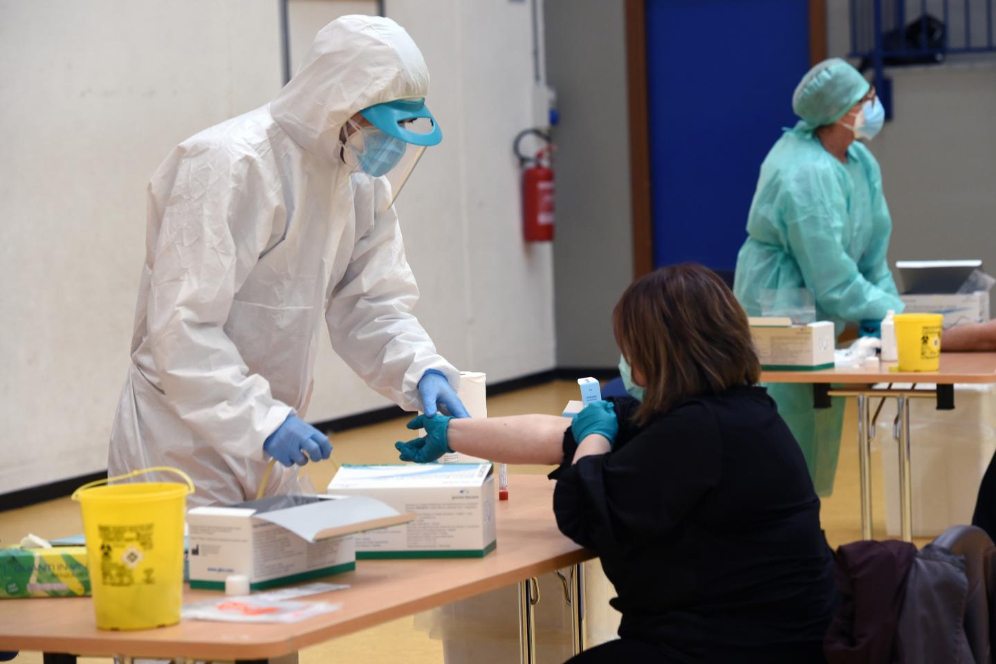 A healthcare professional performs a serological test that can identify who has contracted Coronavirus, perhaps in an asymptomatic form and has produced antibodies, on April 20, 2020 in Milan, Italy.