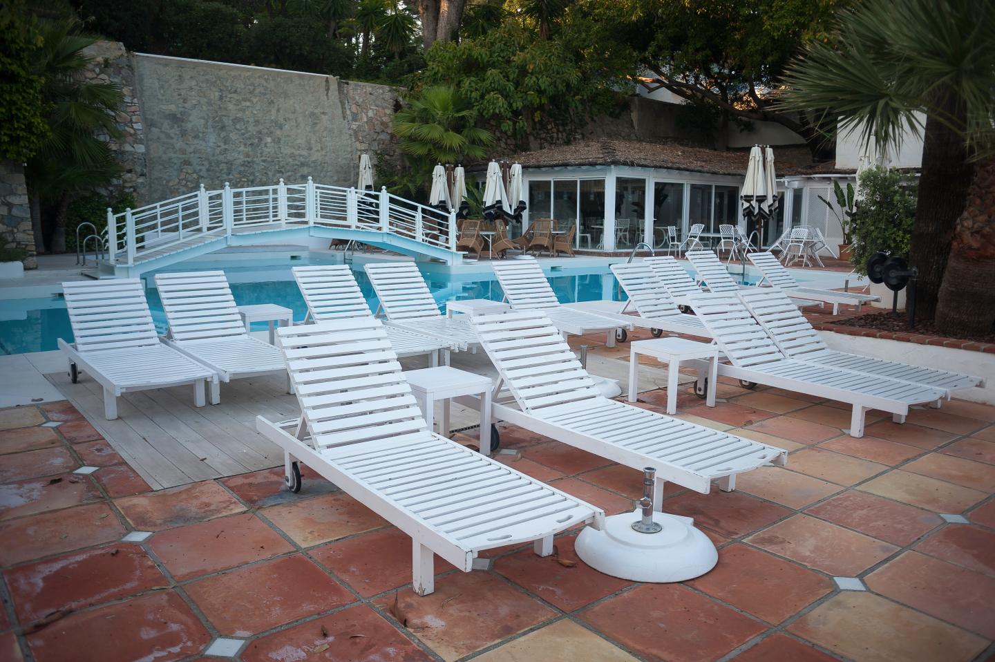 Long chairs are seen in an empty resort in Marbella, amid the coronavirus outbreak disease COVID-19. Following the confinement decreed by the Spanish government to extend the lockdown until 10th May, people are still being confined in their homes causing an exceptional situation of unusual urban scenes such as empty streets or bars, restaurants and shops closed.