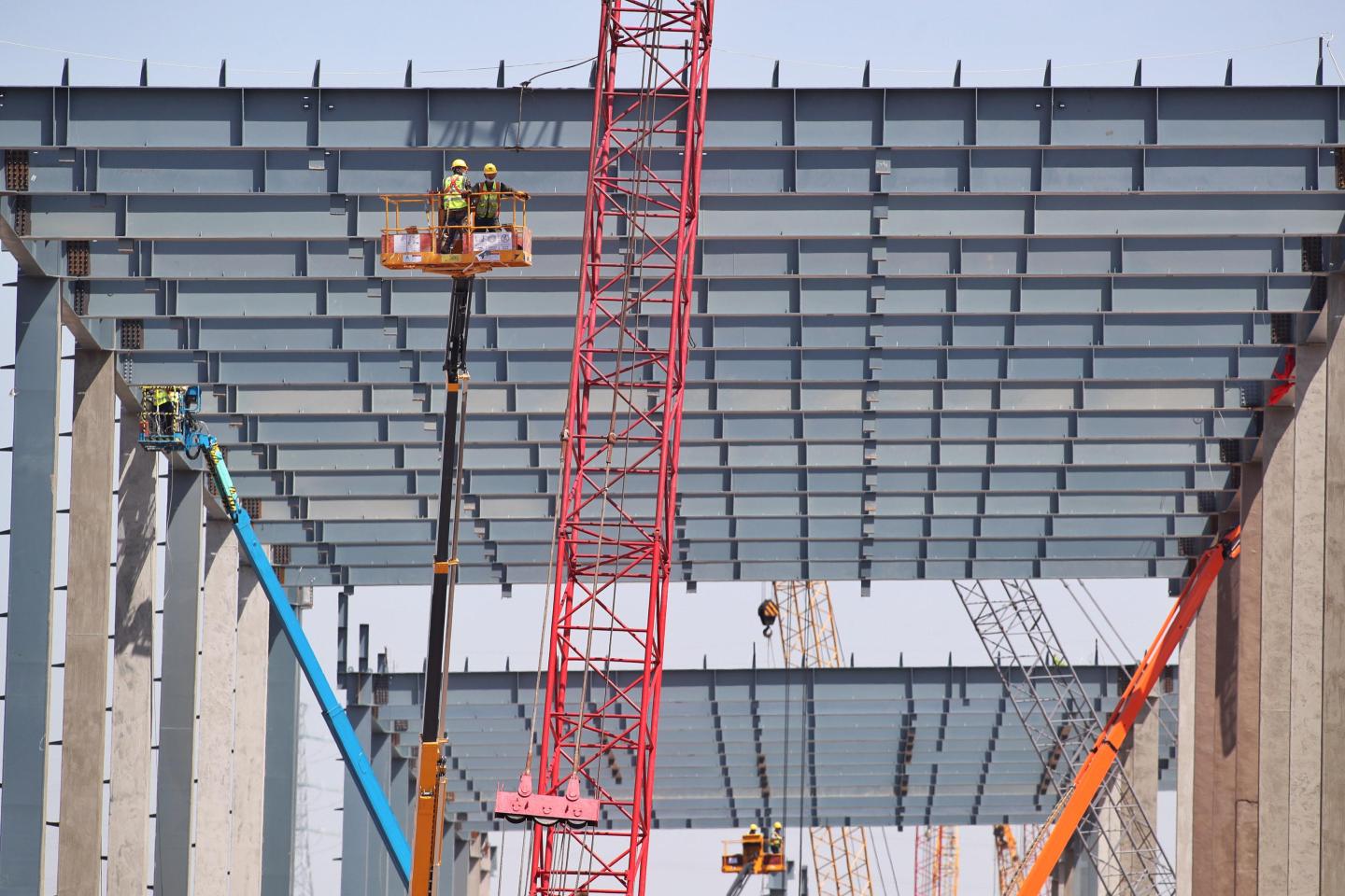SHANGHAI, CHINA - APRIL 07: Workers at the construction site of the second phase of the Tesla Gigafactory at Lingang area, a newly added part of China (Shanghai) Pilot Free Trade Zone, on April 7, 2020 in Shanghai, China. (Photo by Zhang Hengwei/China News Service via Getty Images)