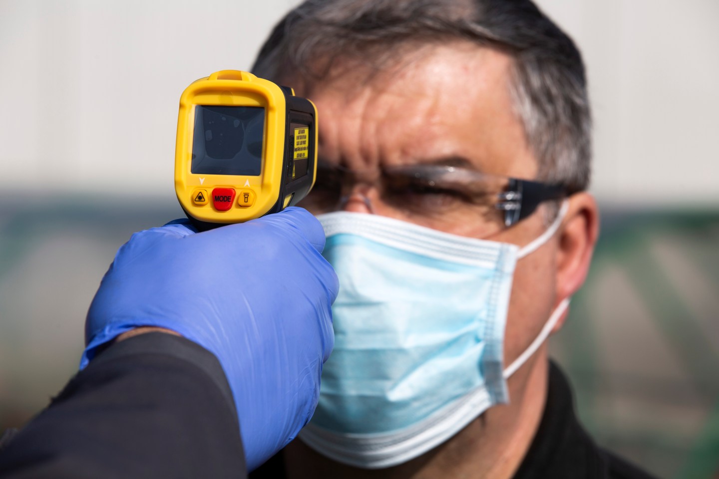 A member of staff at the Vauxhall car factory photographed having his temperature read during preparedness tests and redesign ahead of re-opening following the COVID-19 outbreak.