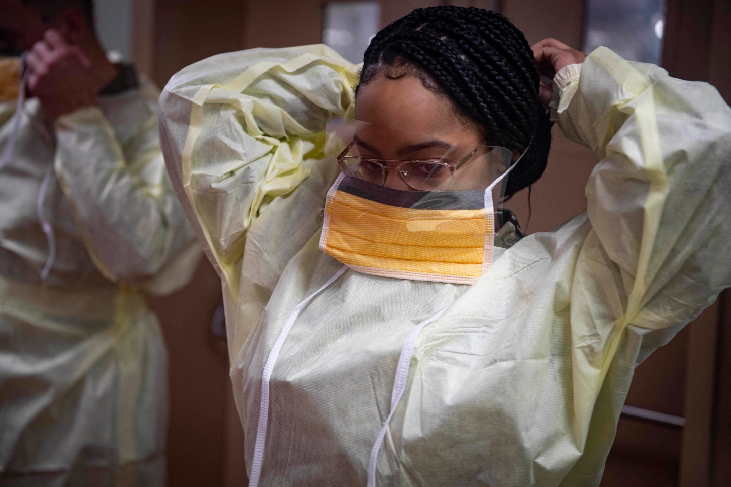 Health Care Worker Putting on Mask-Coronavirus