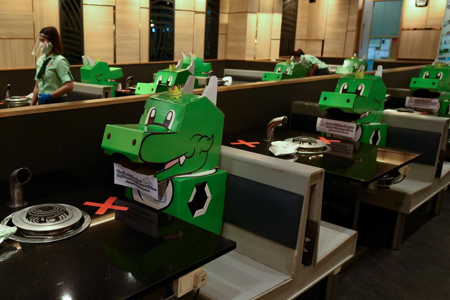Social distance, party of one: Photos showing how the coronavirus is changing how we dine out
