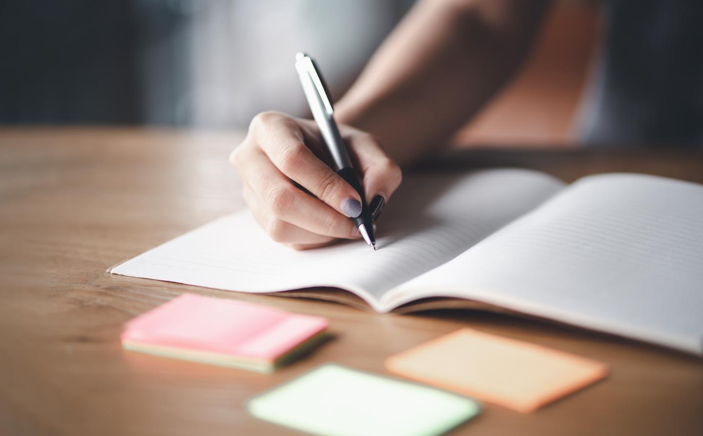 Woman writing in journal