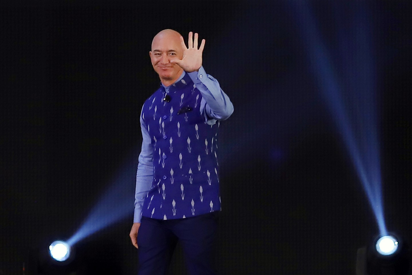 Jeff Bezos, founder and chief executive officer of Amazon.com Inc., waves during the opening session of Amazon Sambhav event in New Delhi, India, on Wednesday, Jan. 15, 2020.