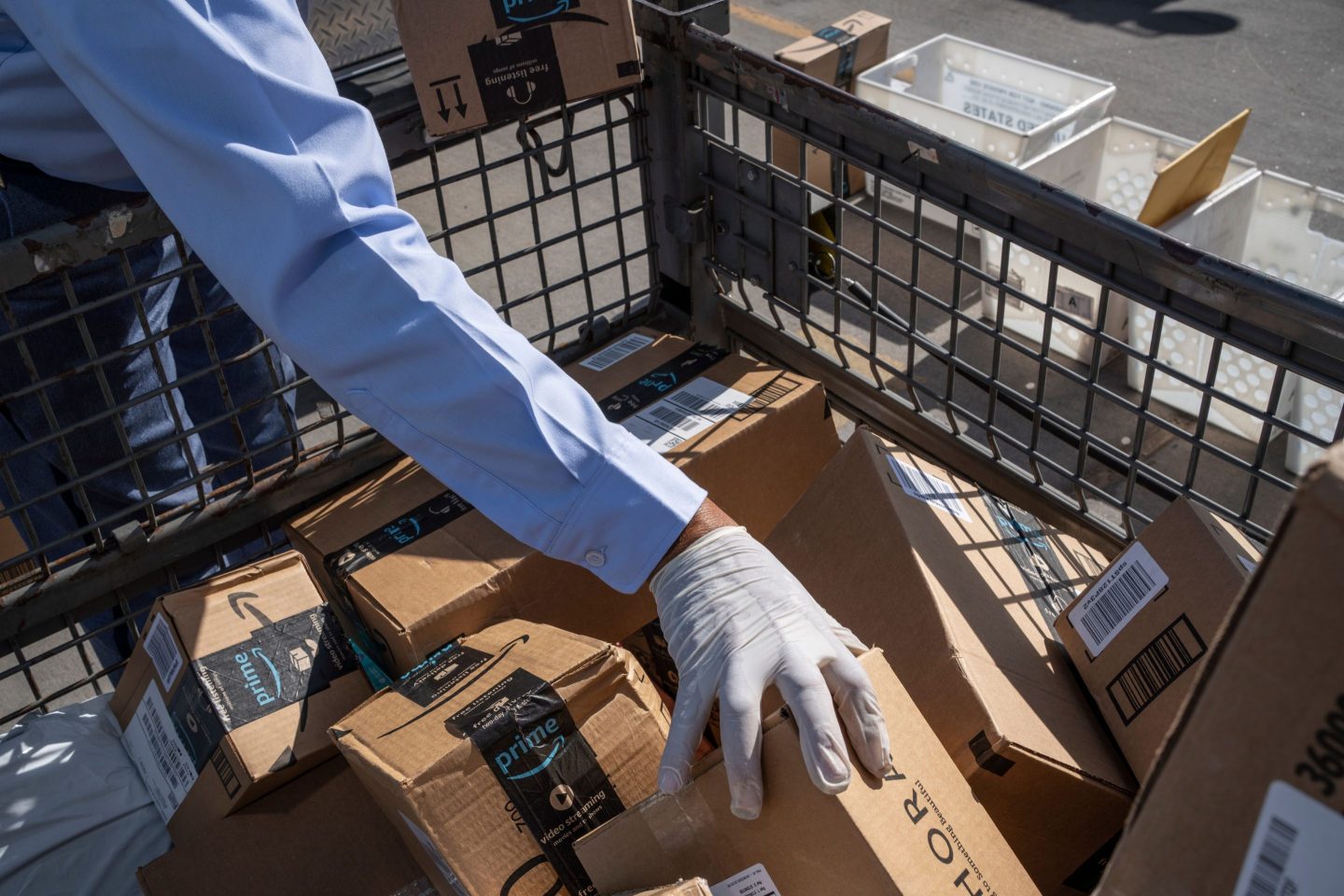 a mail carrier organizes packages