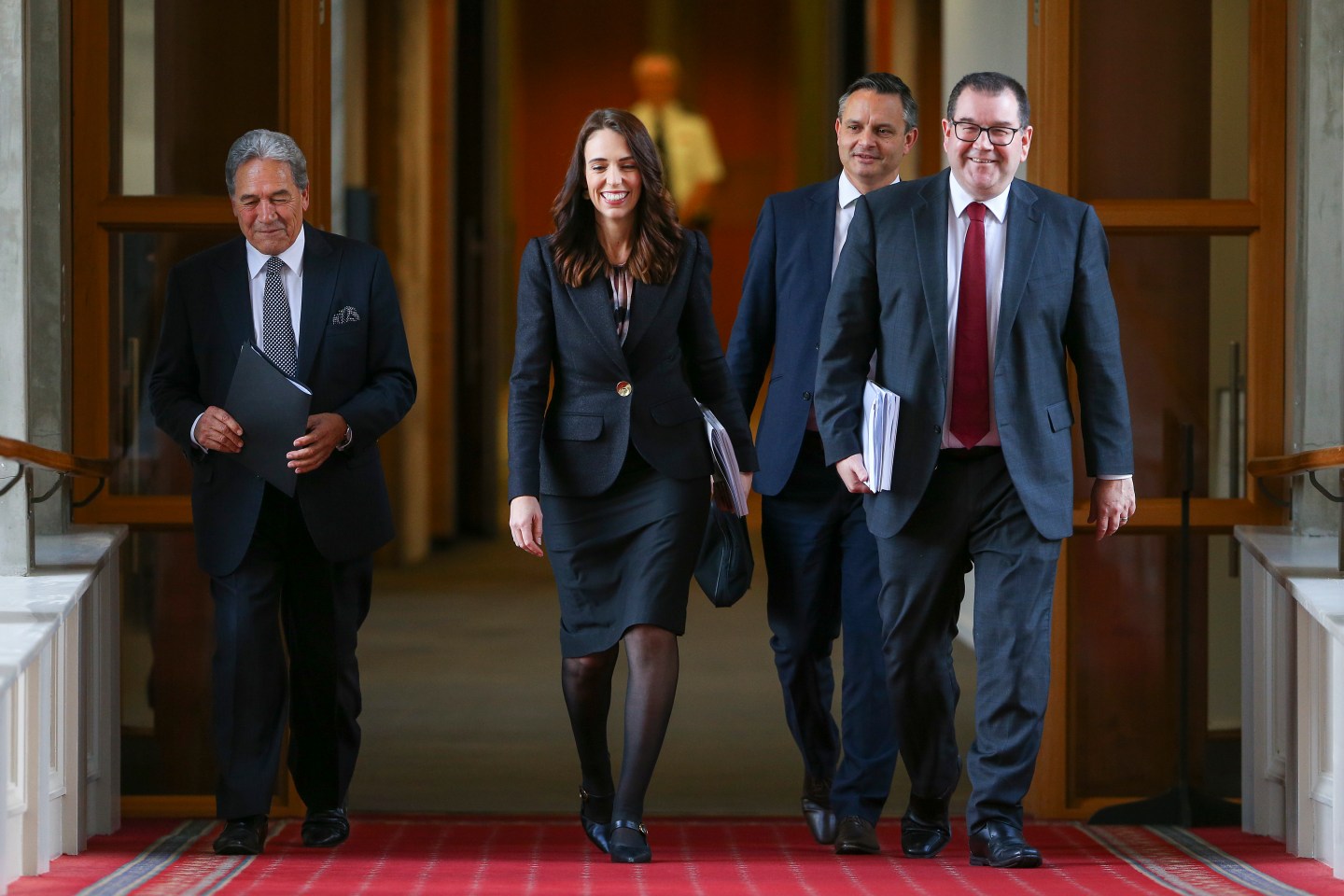 WELLINGTON, NEW ZEALAND - MAY 14: L to R: Deputy Prime Minister Winston Peters, Prime Minister Jacinda Ardern, Greens leader James Shaw and Finance Minister Grant Robertson walk to the house during Budget 2020 delivery day at Parliament May 14, 2020 in Wellington, New Zealand. Budget 2020 is the second budget handed down by Finance Minister Grant Robertson, with a focus on funding to create and retain jobs in the wake of the COVID-19 pandemic. In the single biggest spending package in New Zealand’s history, $50 billion has been allocated to the COVID-19 response and economic recovery plan, with an aim to to save almost 140,000 jobs across the country. The plan includes $3.2 billion for an eight-week extension of the current wage subsidy scheme. (Photo by Hagen Hopkins/Getty Images)