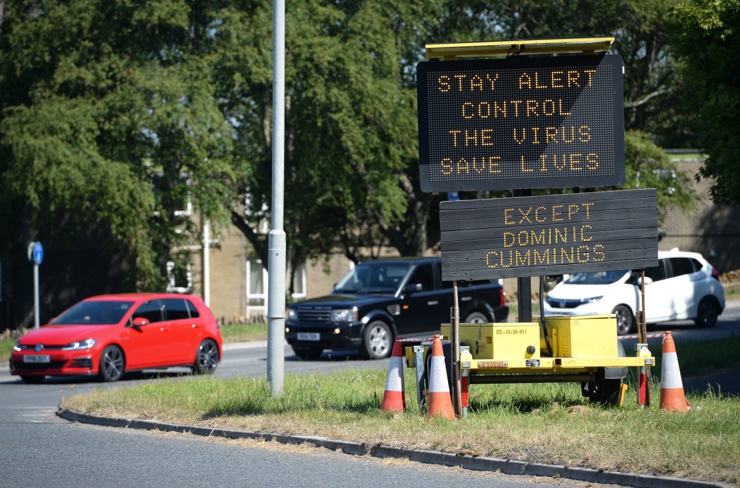 BRIDPORT, ENGLAND - MAY 27: A road sign stating 'Stay Alert, Control the Virus, Save Lives' has an additional sign added by members of the public stating 'Except Dominic Cummings' on May 27, 2020 in Bridport, United Kingdom. The British government continues to ease the coronavirus lockdown by announcing schools will open to reception year pupils plus years one and six from June 1st. Open-air markets and car showrooms can also open from the same date. (Photo by Finnbarr Webster/Getty Images)
