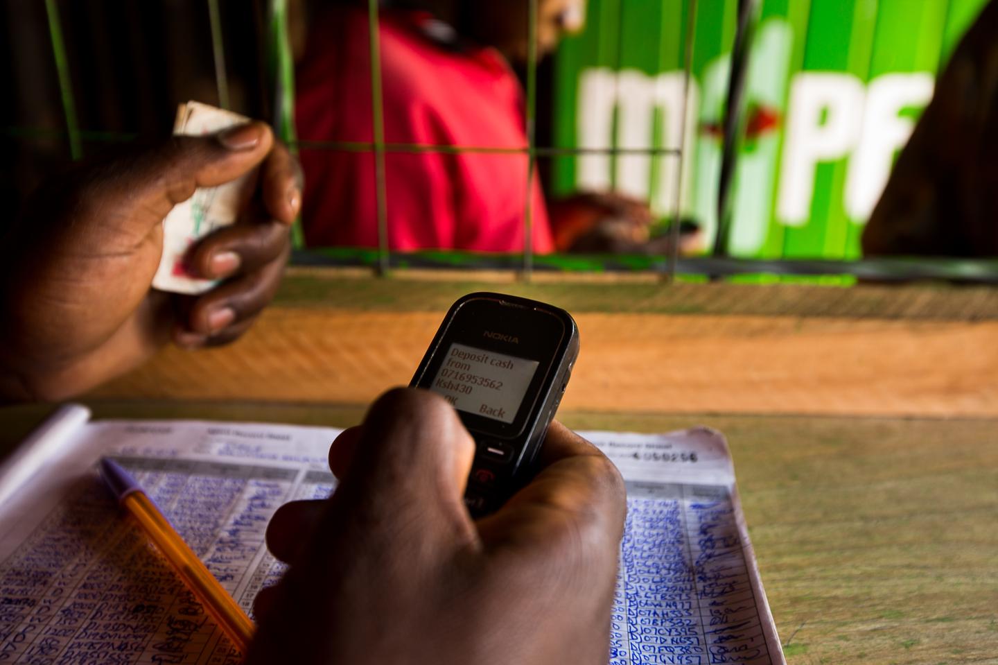 employee using m-pesa digital payments system