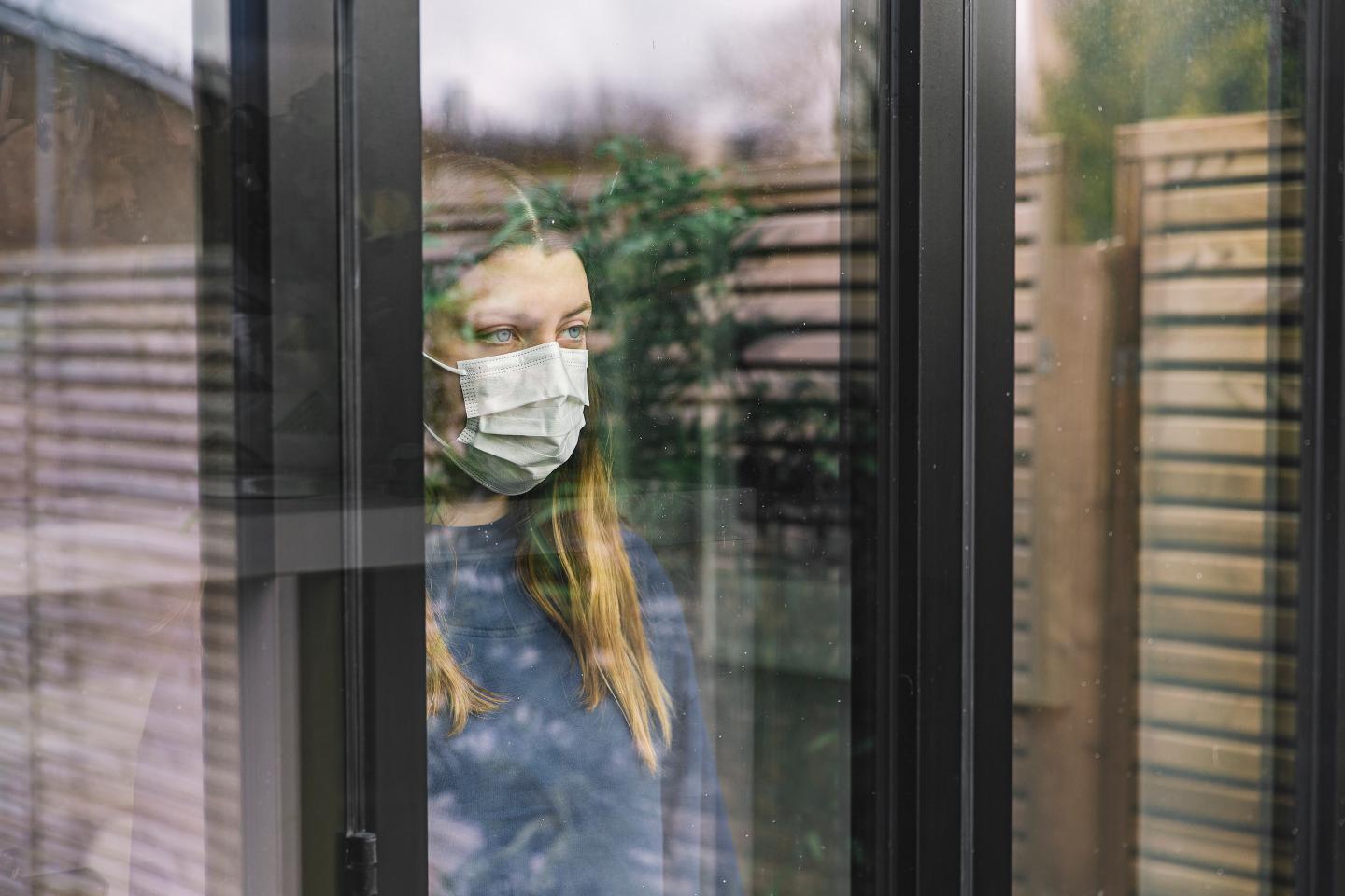 sad woman with mask