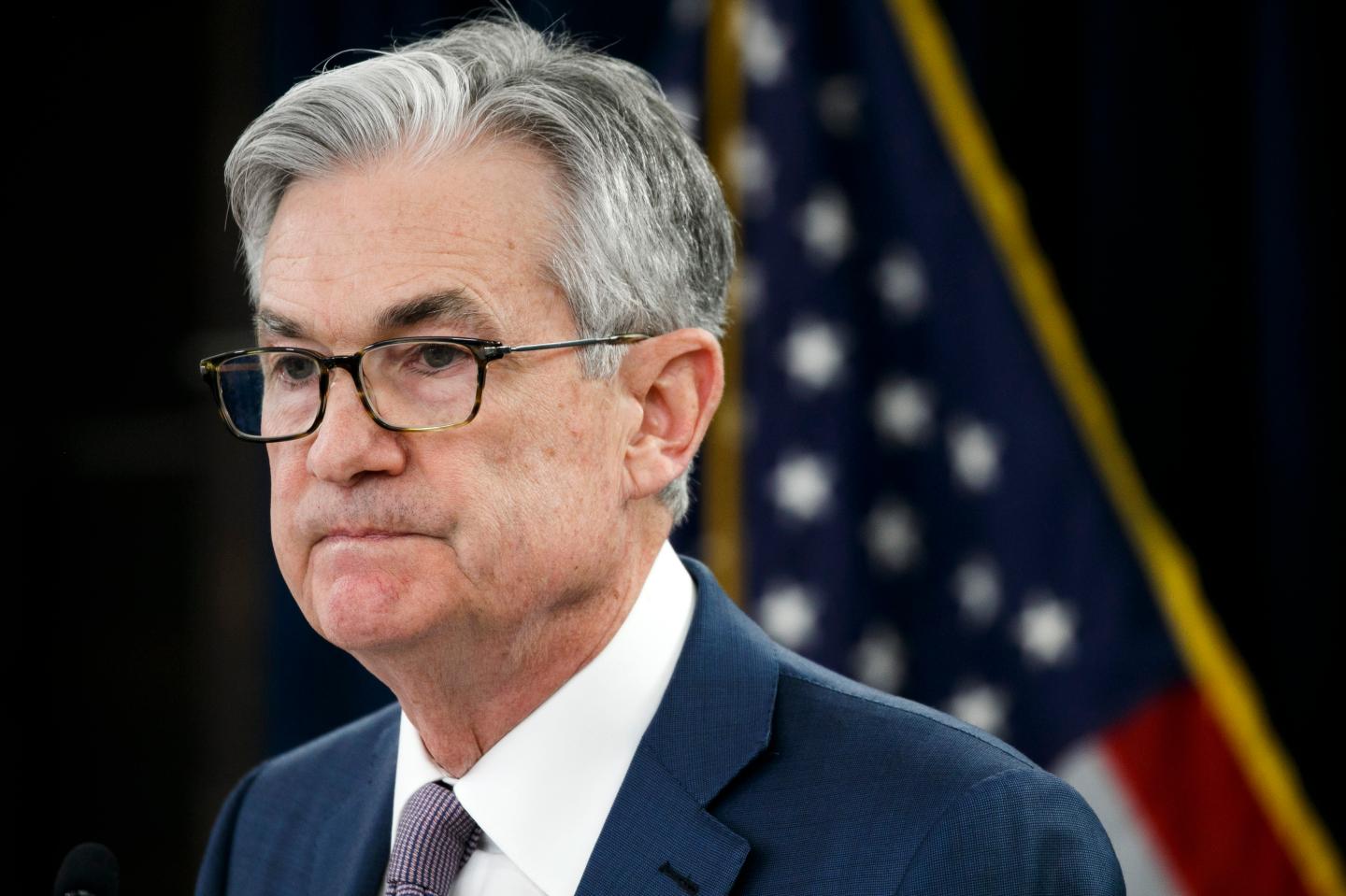 Fed says interest rates likely to stay near zero through 2022