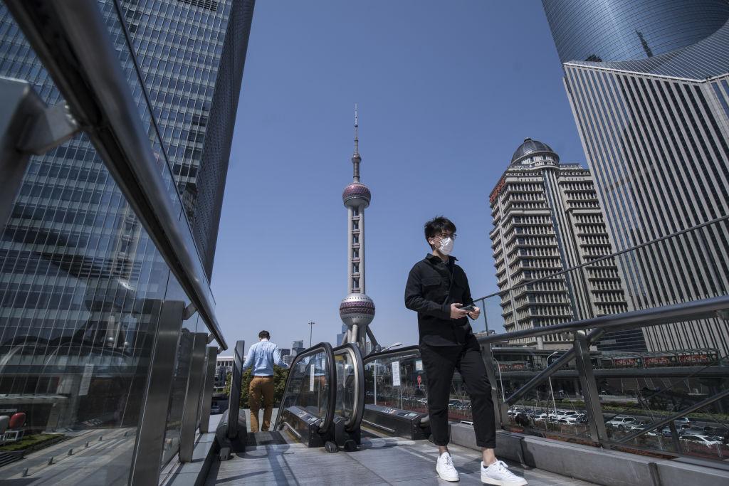 Office Workers in Shanghai as Premier Says Most of China Is Returning to Normal