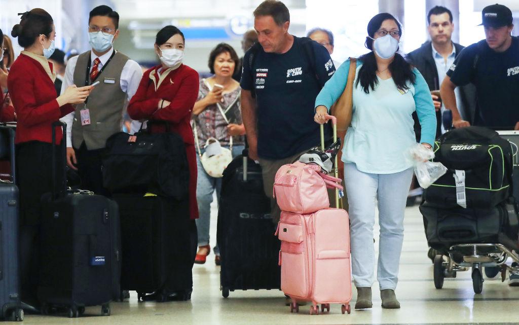 Flight Crews Wear Protective Gear For International Flights
