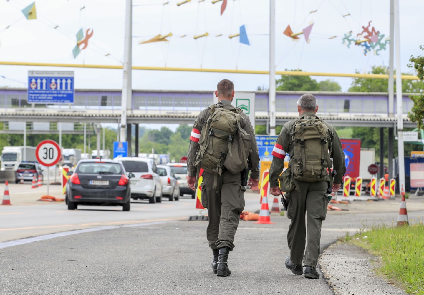 Austrian soldiers patrol at the Austrian-Slovenian border at the checkpoint near Spielfeld, Austria, on June 5, 2020. Austria scrapped entry checks at its land borders introduced because of the coronavirus pandemic, except those at the frontier with Italy. Slovenia reciprocated the reopening from Friday, June 5, 2020 and lets in people travelling from Austria without checks.