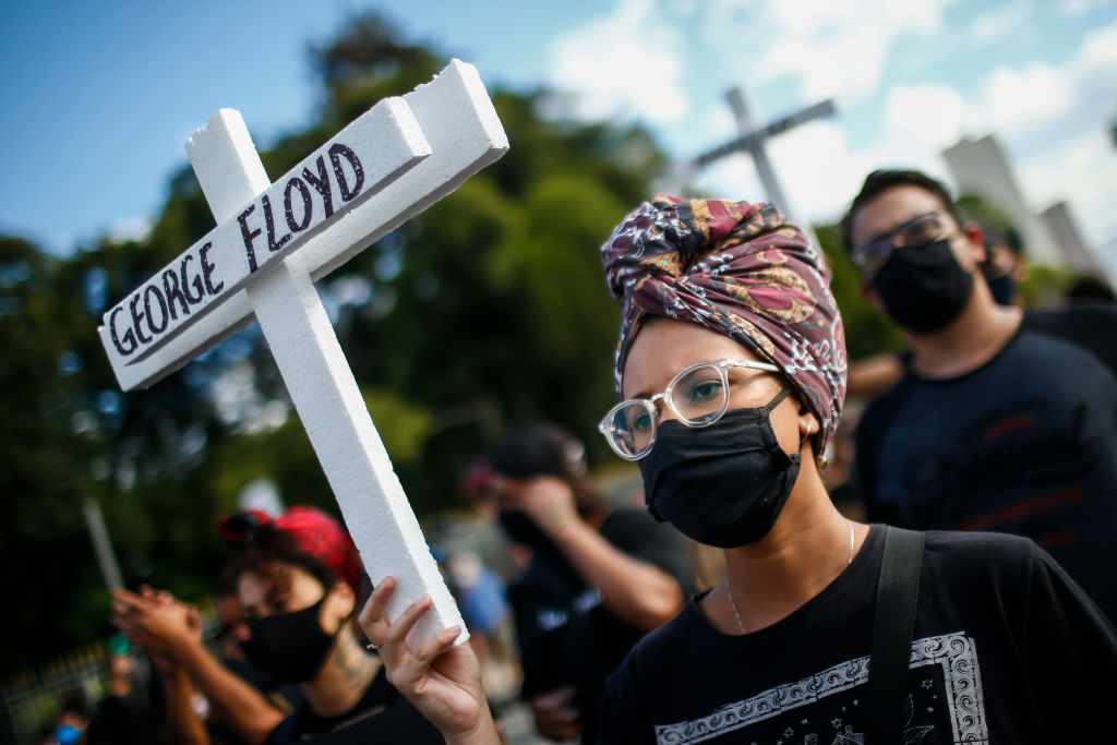 Woman wearing a face mask during a protest over the killing of George Floyd