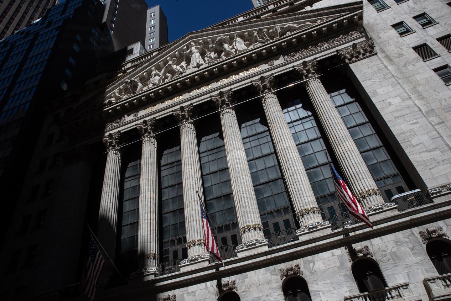 Major indices eke out gains Monday as Fed says it will begin buying individual corporate bonds