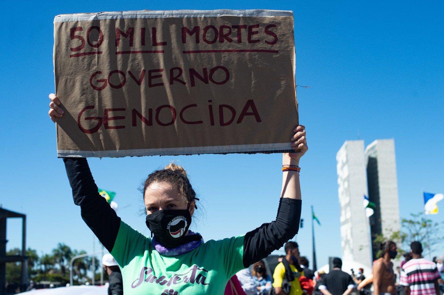 People attend an anti-racist protest and against the government of President Jair Bolsonaro amidst the coronavirus (COVID-19) pandemic at the Esplanada dos Minsitérios on June 21, 2020 in Brasilia. Brazil has over 1.000,000 confirmed positive cases of Coronavirus and has over 50,000 deaths.