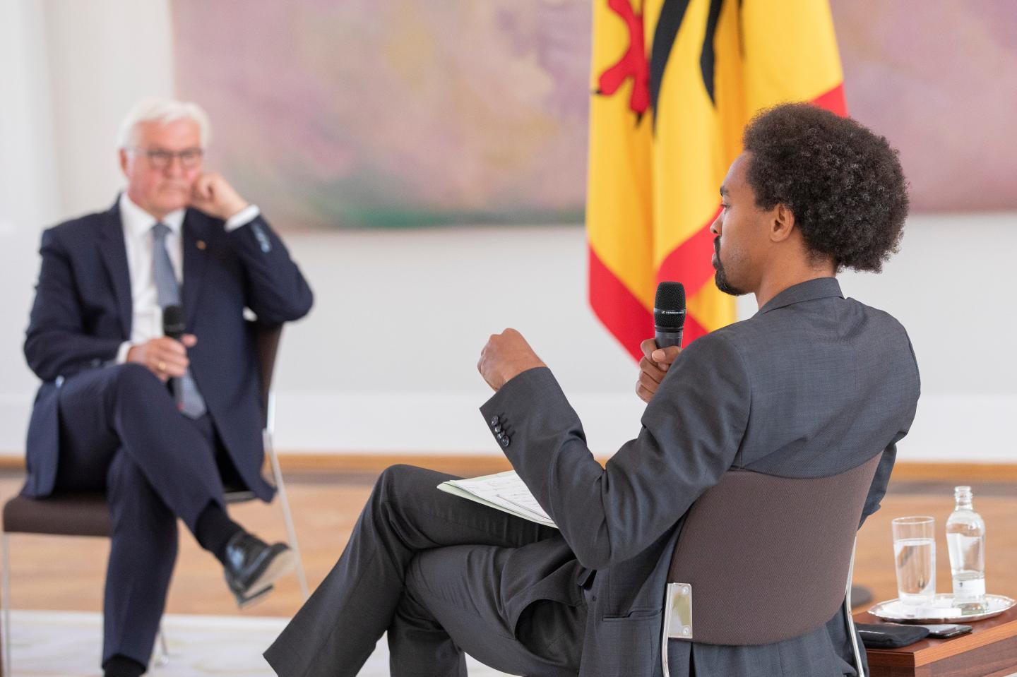 German President Frank-Walter Steinmeier (L) speaks with Daniel Gyamerah division manager of Think-Tanks "Citizens For Europe" in Berlin while hosting a discussion on racism in Germany at Schloss Bellevue palace on June 16, 2020 in Berlin, Germany. German cities have seen their own share of protests against racism and police violence since the death of George Floyd in the USA.