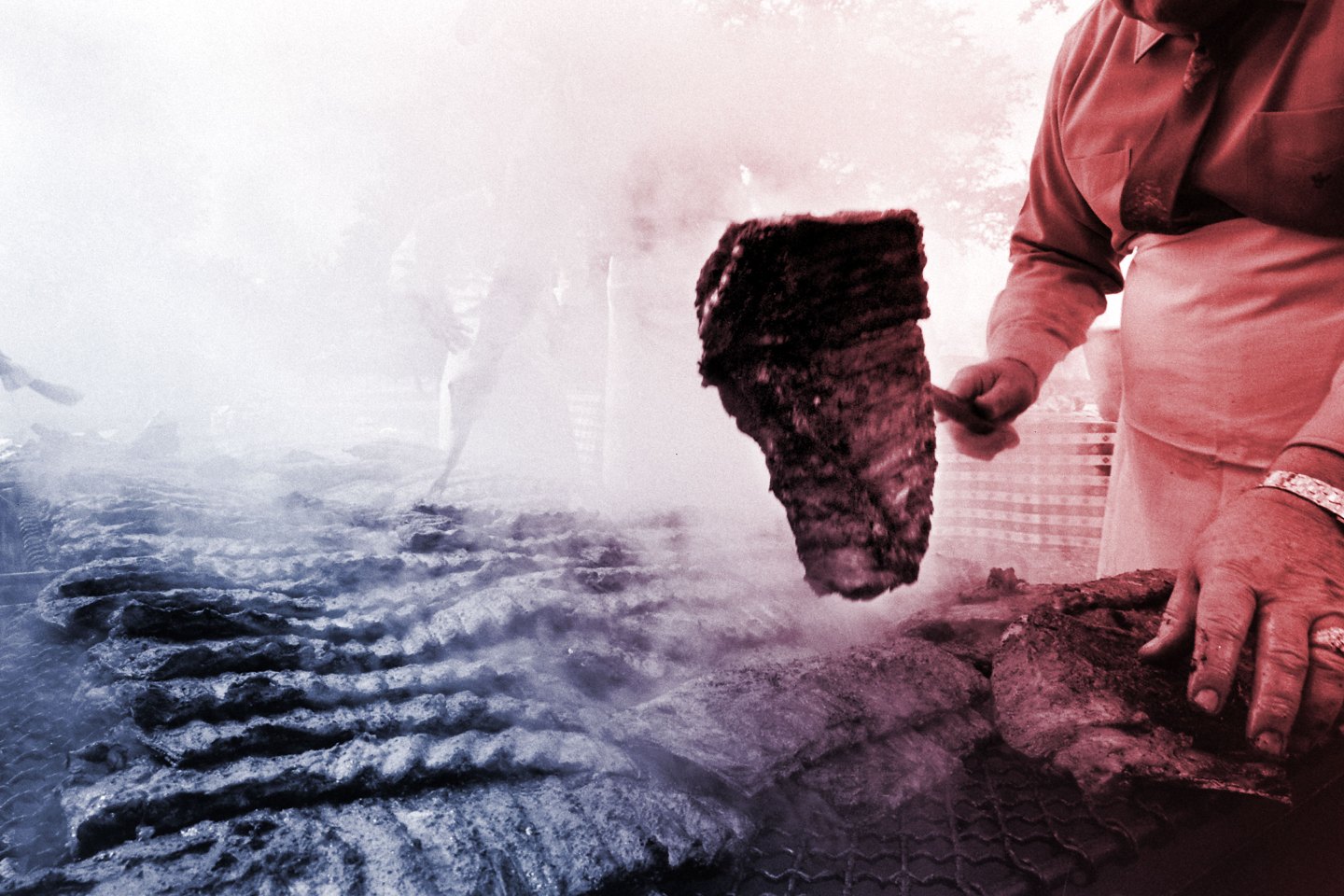 Barbecuing meat during West German Chancellor Ludwig Erhard's visit to President Lyndon Johnson's ranch in Johnson City, Texas, December 1963