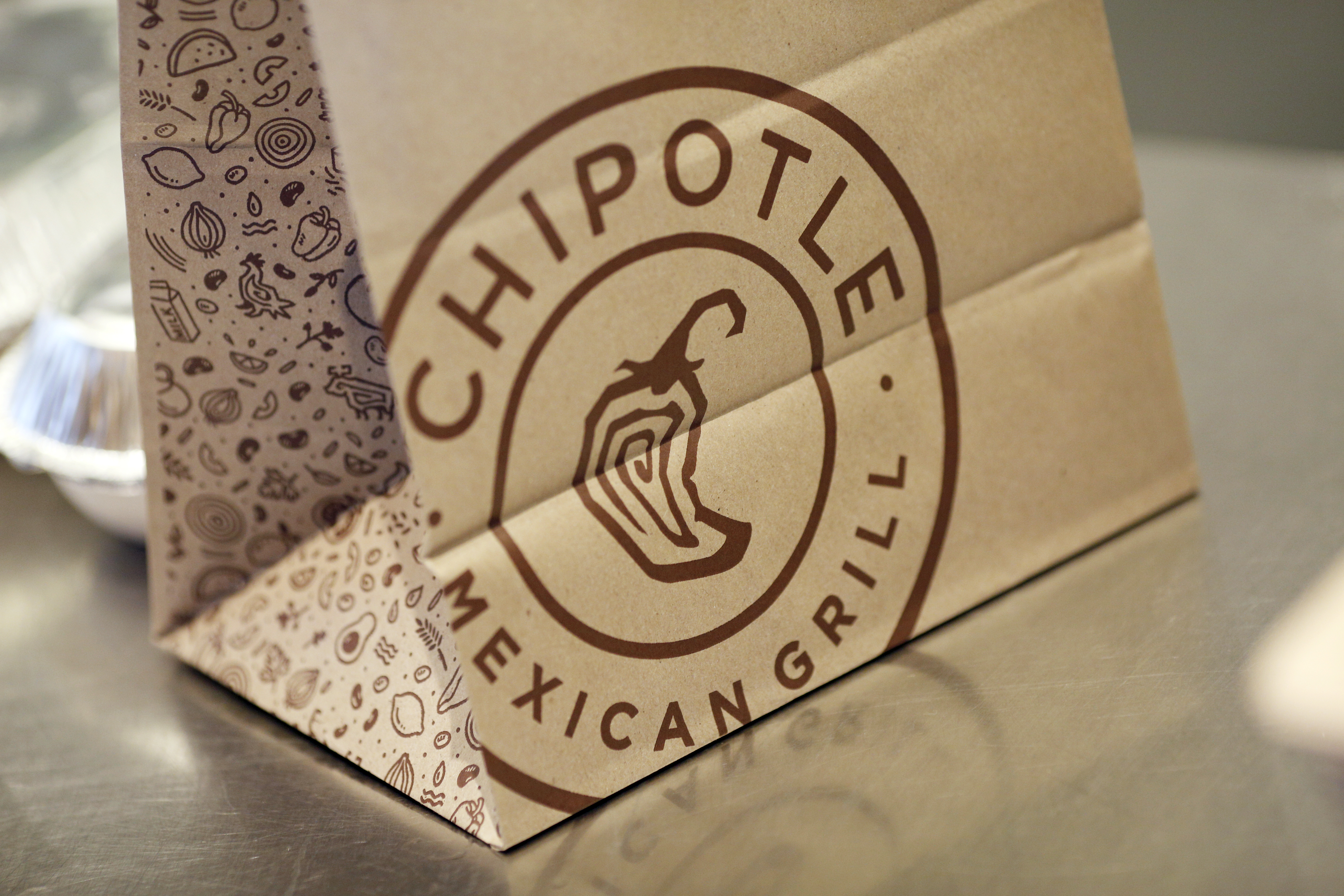 Signage is displayed on a to-go bag at a Chipotle Mexican Grill Inc. restaurant in Louisville, Kentucky, U.S., on Saturday, Feb. 2, 2019. Chipotle Mexican Grill Inc. is scheduled to release earnings figures on February 6. Photographer: Luke Sharrett/Bloomberg via Getty Images