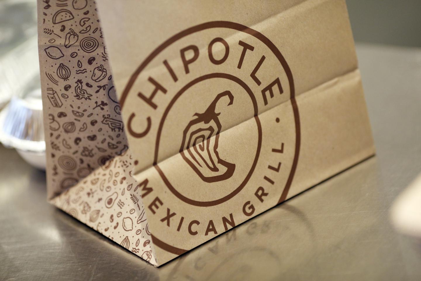 Signage is displayed on a to-go bag at a Chipotle Mexican Grill Inc. restaurant in Louisville, Kentucky, U.S., on Saturday, Feb. 2, 2019. Chipotle Mexican Grill Inc. is scheduled to release earnings figures on February 6. Photographer: Luke Sharrett/Bloomberg via Getty Images