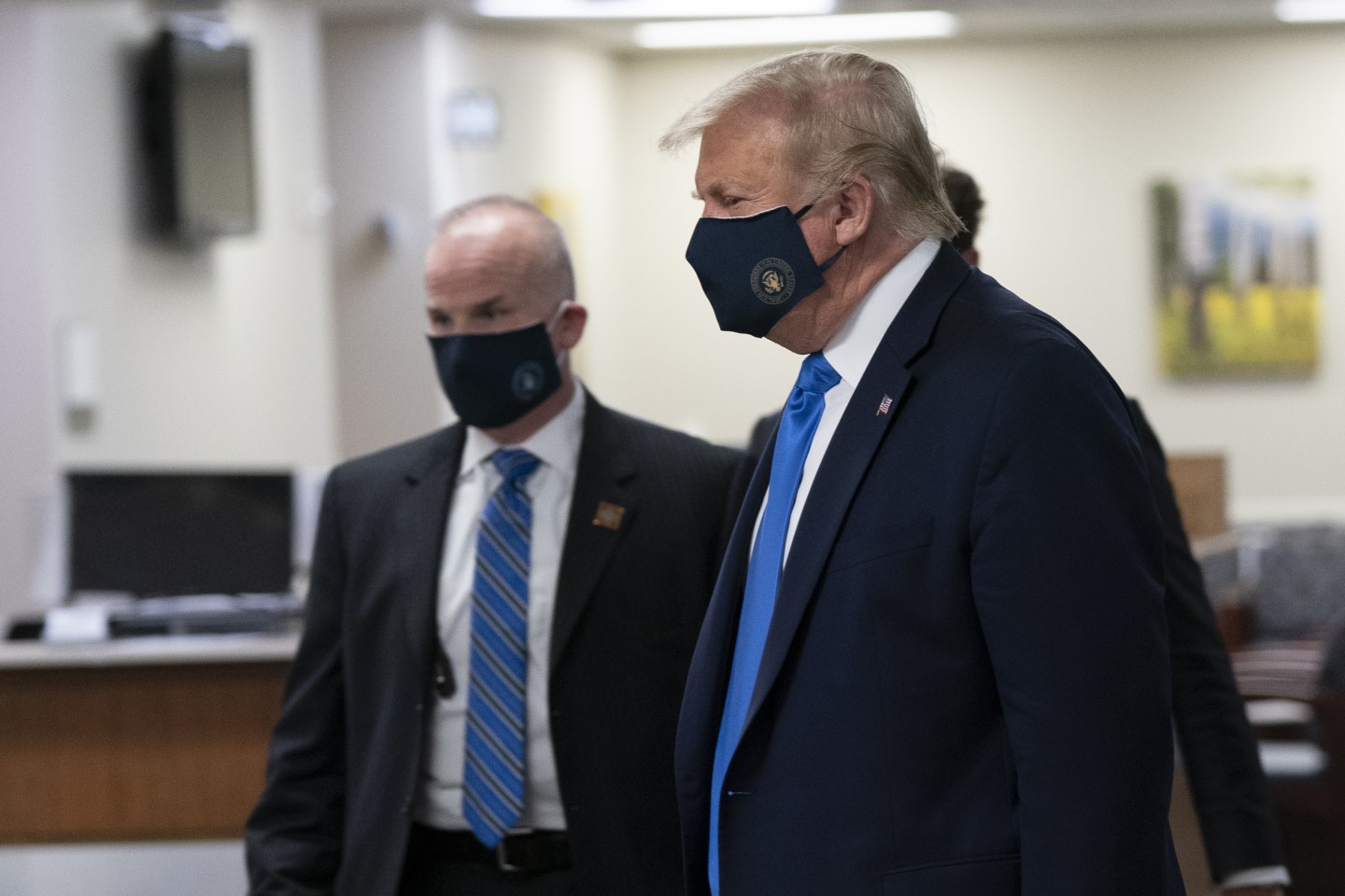 U.S. President Donald Trump wears a protective mask while visiting Walter Reed National Military Medical Center in Bethesda, Maryland, U.S., on Saturday, July 11, 2020. Trump wearing a mask is the first public photo opportunity since the start of the coronavirus outbreak as cases continue to pile up.