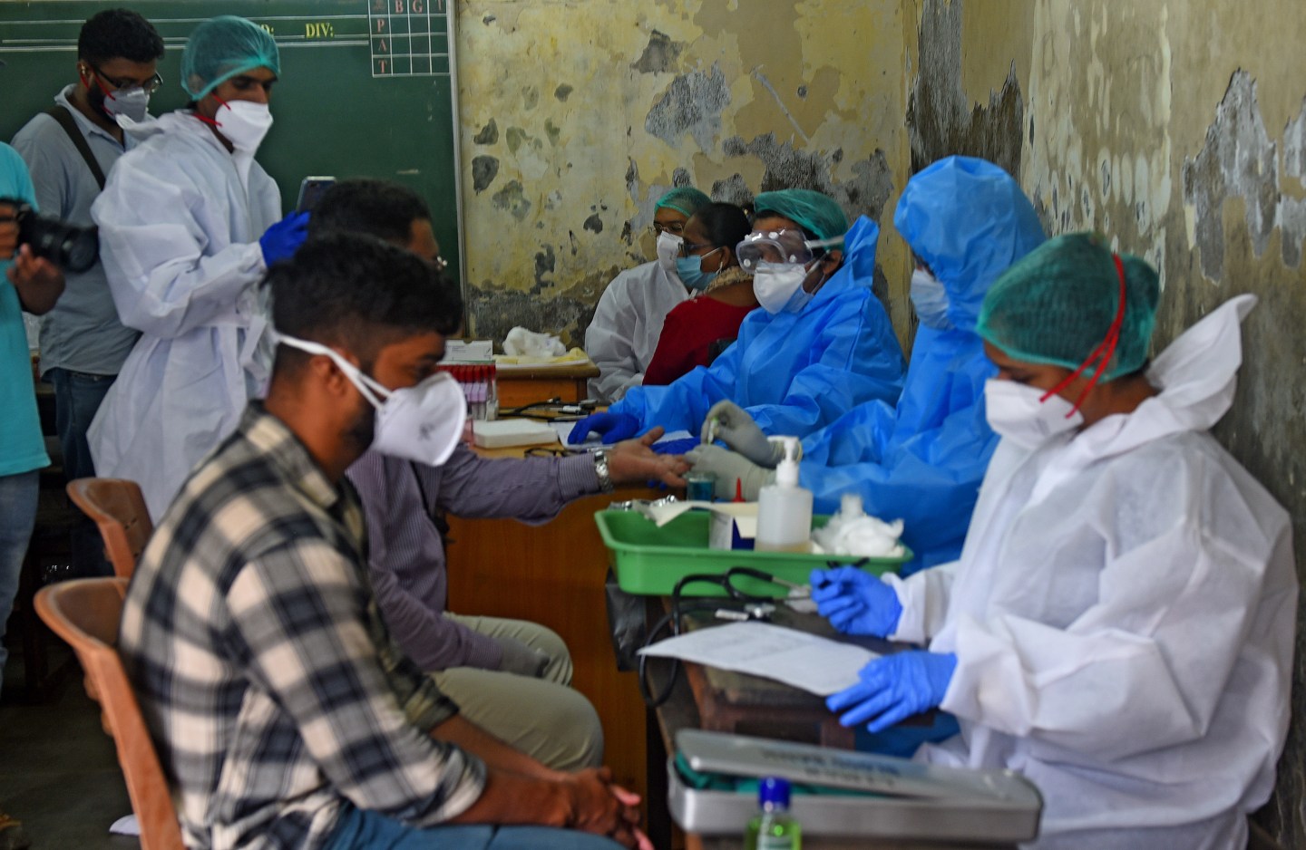 Health workers collect plasma samples from patients who recovered from Covid-19 at Dharavi, on July 27, 2020 in Mumbai, India.