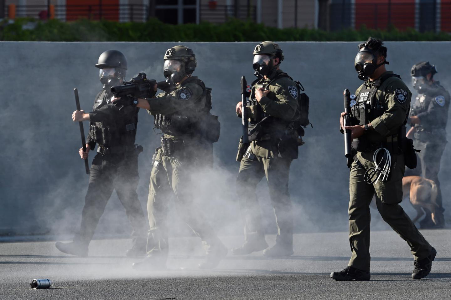 California police in military style gear and face masks at BLM protests.