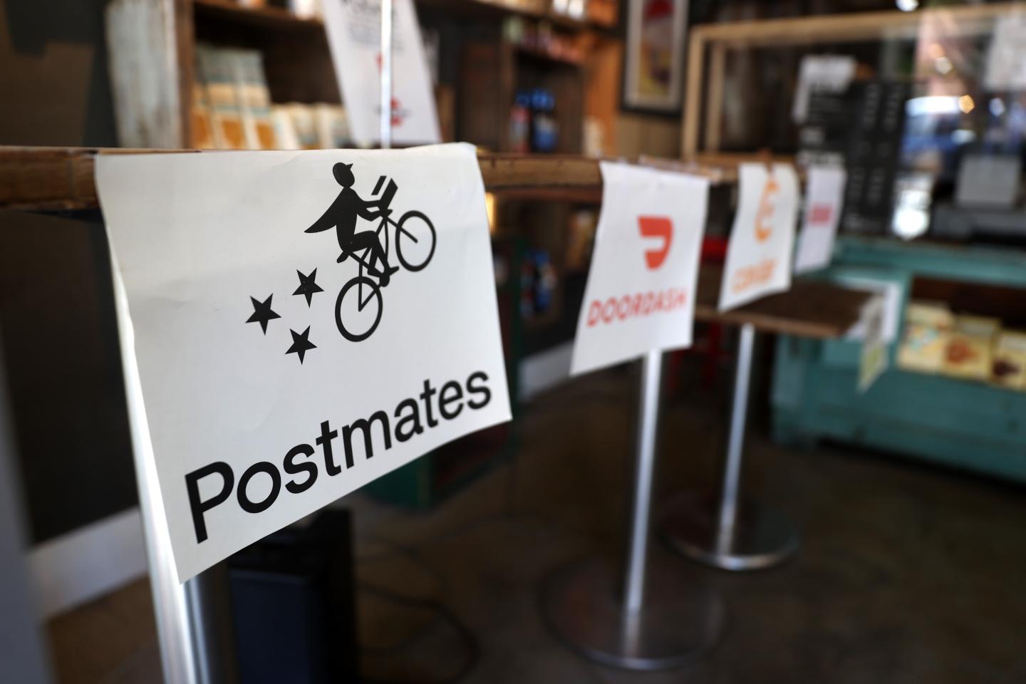 Gig workers sound off on the Uber-Postmates deal: ‘It’s like an embezzler buying a bank’
