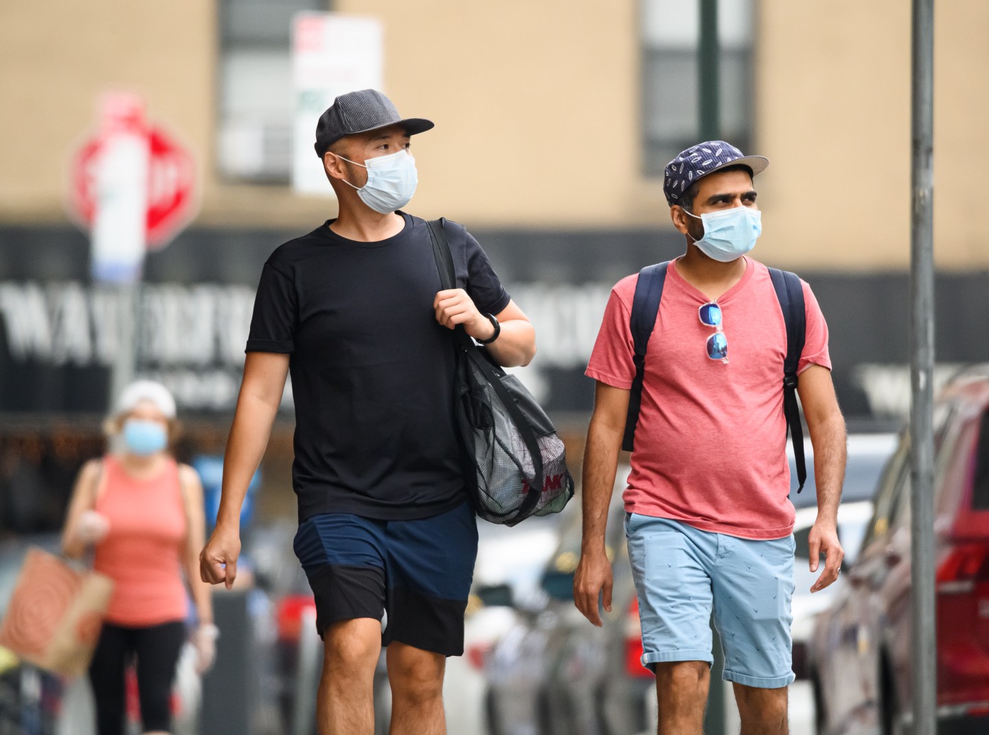 People wear protective face masks in Kips Bay as the city enters Phase 4 of re-opening following restrictions imposed to slow the spread of coronavirus on July 23, 2020 in New York City.