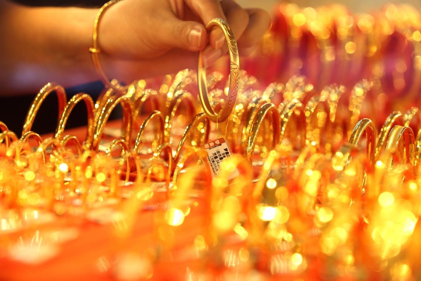 Gold hits an all-time high as investors weigh the costs of fresh stimulus measures