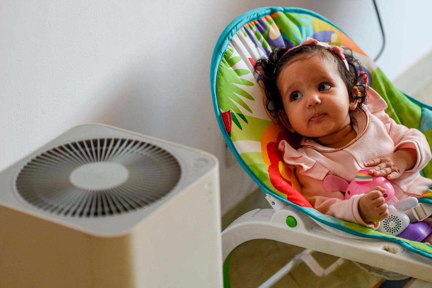 Baby with air purifier