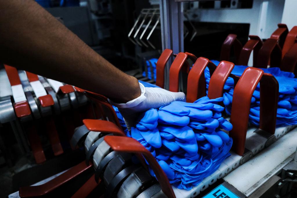 Top Glove, The Worlds Biggest Glovemaker, Raises Money as Virus Fuels Demand