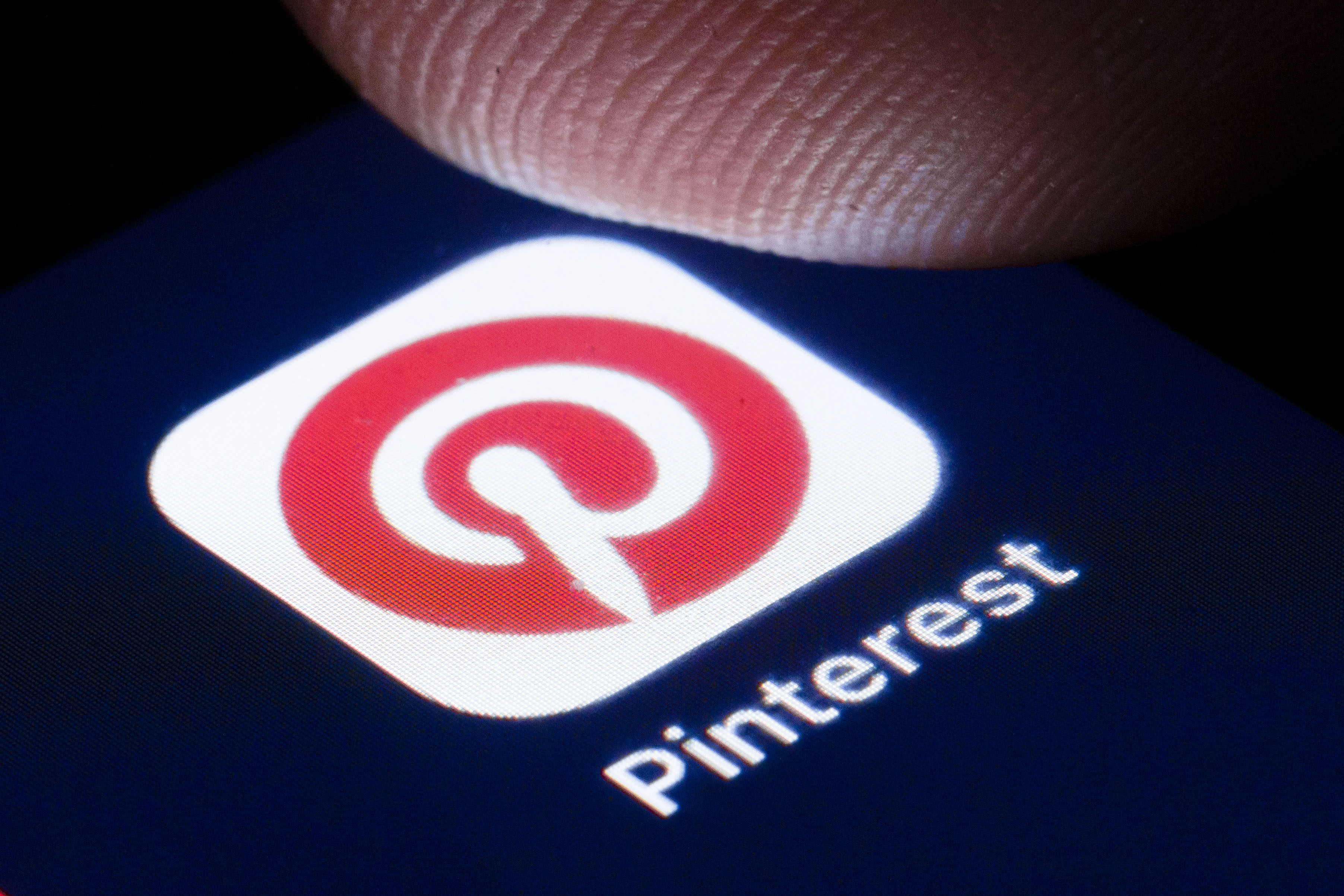 BERLIN, GERMANY - APRIL 22: The logo of the photo online community Pinterest is shown on the display of a smartphone on April 22, 2020 in Berlin, Germany. 