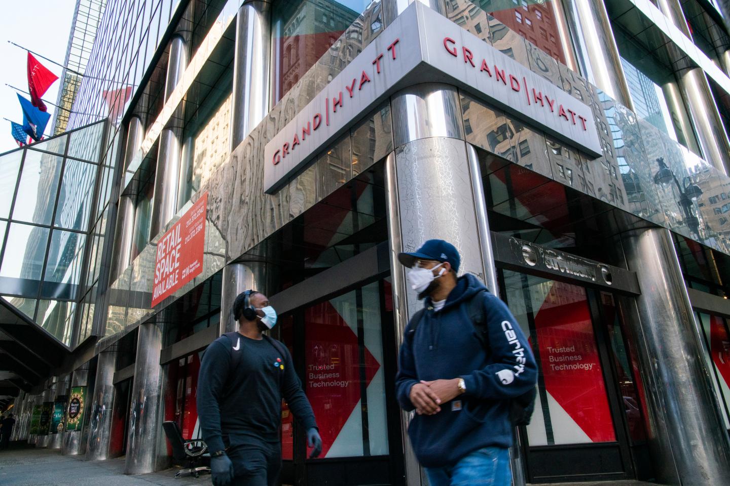 People walk around the International Hotel Grand Hyatt during the outbreak of the COVID-19 pandemic on May 21, 2020 in New York City.